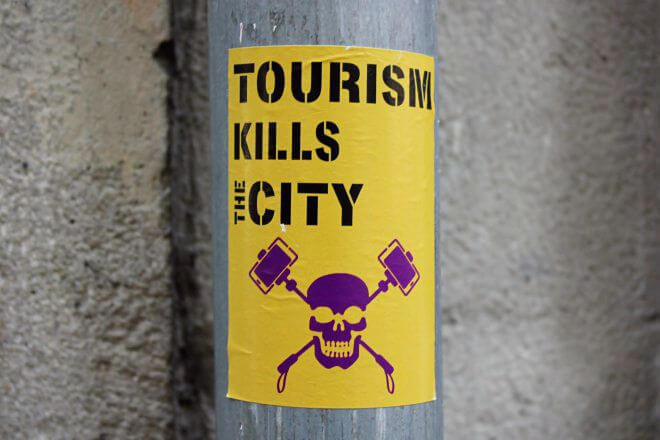 Protest Signs: Tourism Kills the City