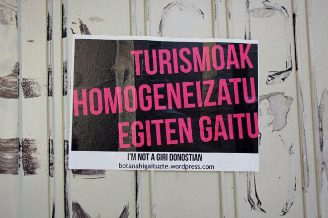 Protest Signs: Tourism Makes Us Uniform (Basque)