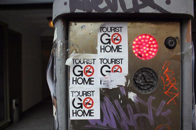 Protest Signs: Tourist Go Home